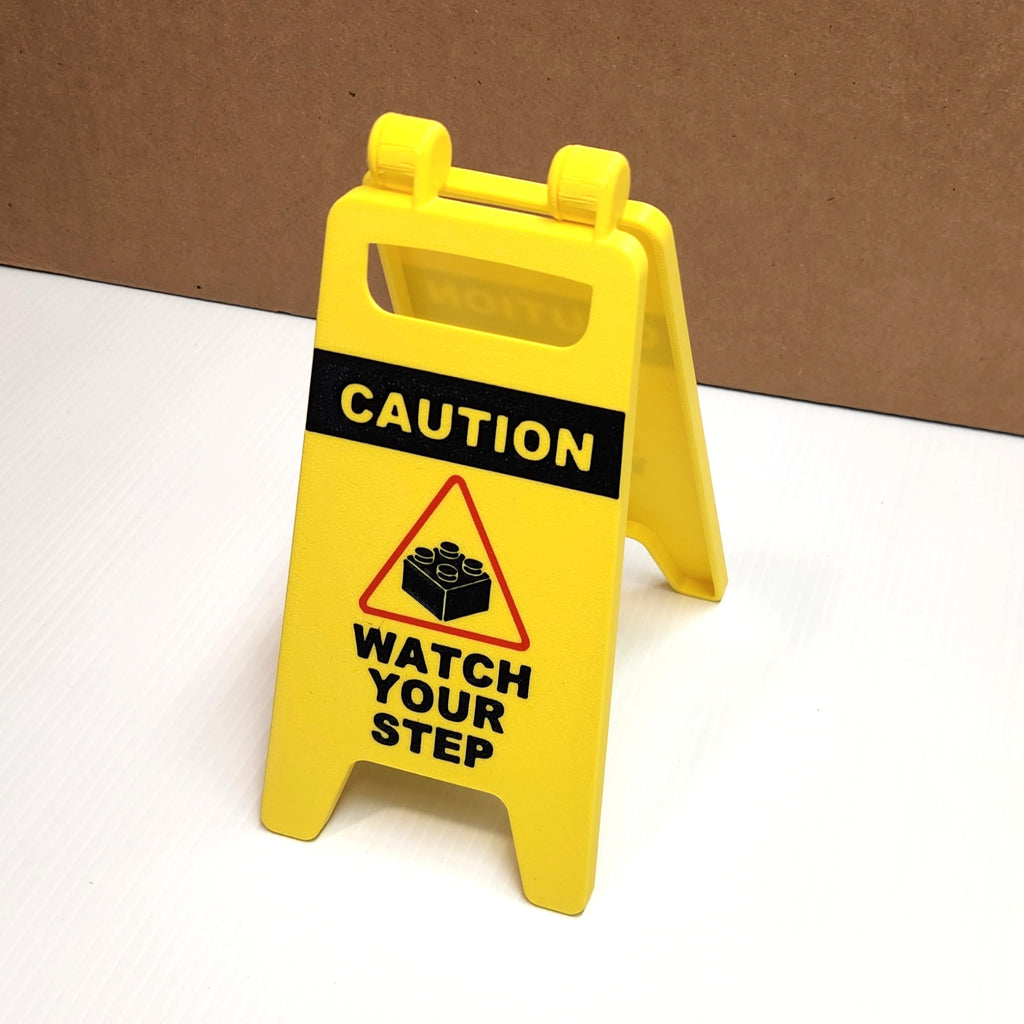 Brick‑Themed Warning Sign – Mini “Wet Floor” Style Decor (Two Sizes)