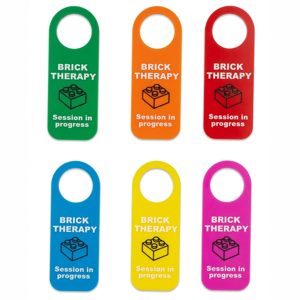 Six colorful hanging tags labeled 'BRICK THERAPY' with a brick icon and 'Session in progress' text, shown on a white background.